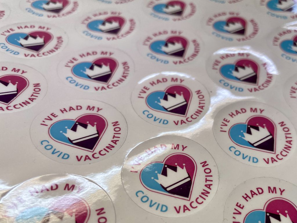 A sheet of stickers with an image of a crown within a heart and the words "I've had my COVID vaccination"